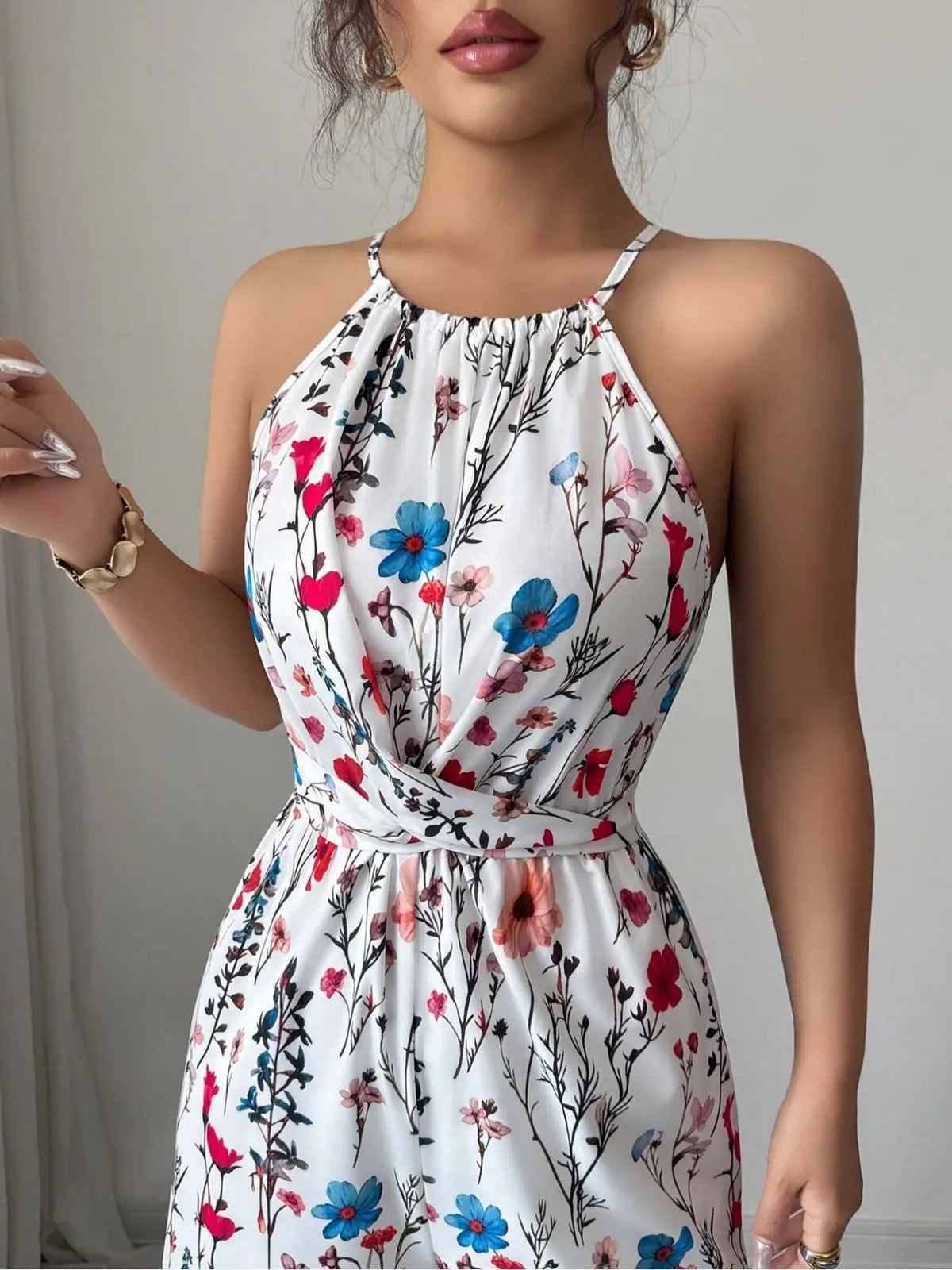 Bloemenprint halternek maxi jumpsuit met wijde palazzo-pijpen Venzali