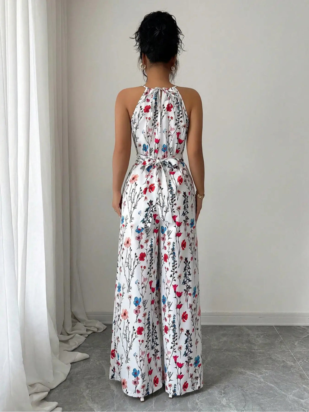 Bloemenprint halternek maxi jumpsuit met wijde palazzo-pijpen Venzali
